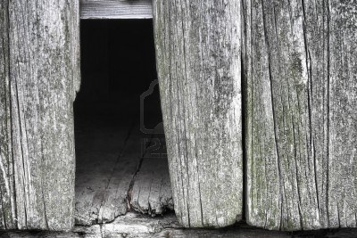 12837889-old-and-weathered-grey-barn-wall-with-empty-hole-from-broken-and-missing-barnwood-board-showing-aged
